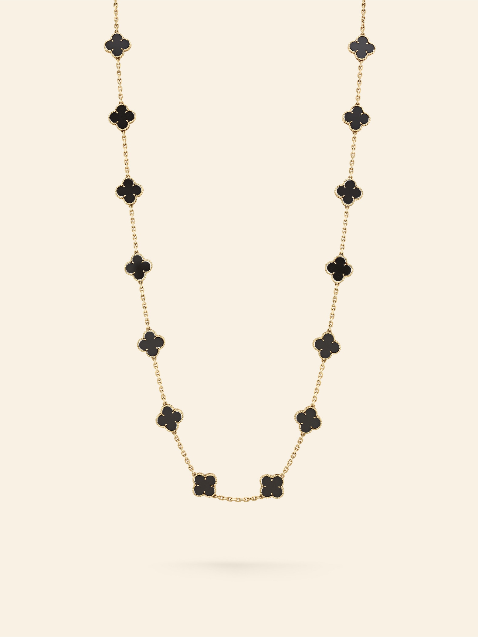 Alhambra long necklace, 1978​. 18K yellow gold, onyx​. Van Cleef & Arpels Collection.