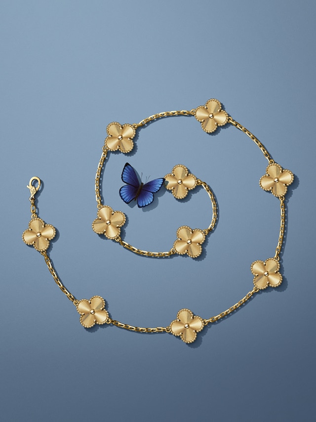 Vintage Alhambra long necklace, 20 motifs, guilloché 18K yellow gold, diamonds. Alhambra® collection, Van Cleef & Arpels.