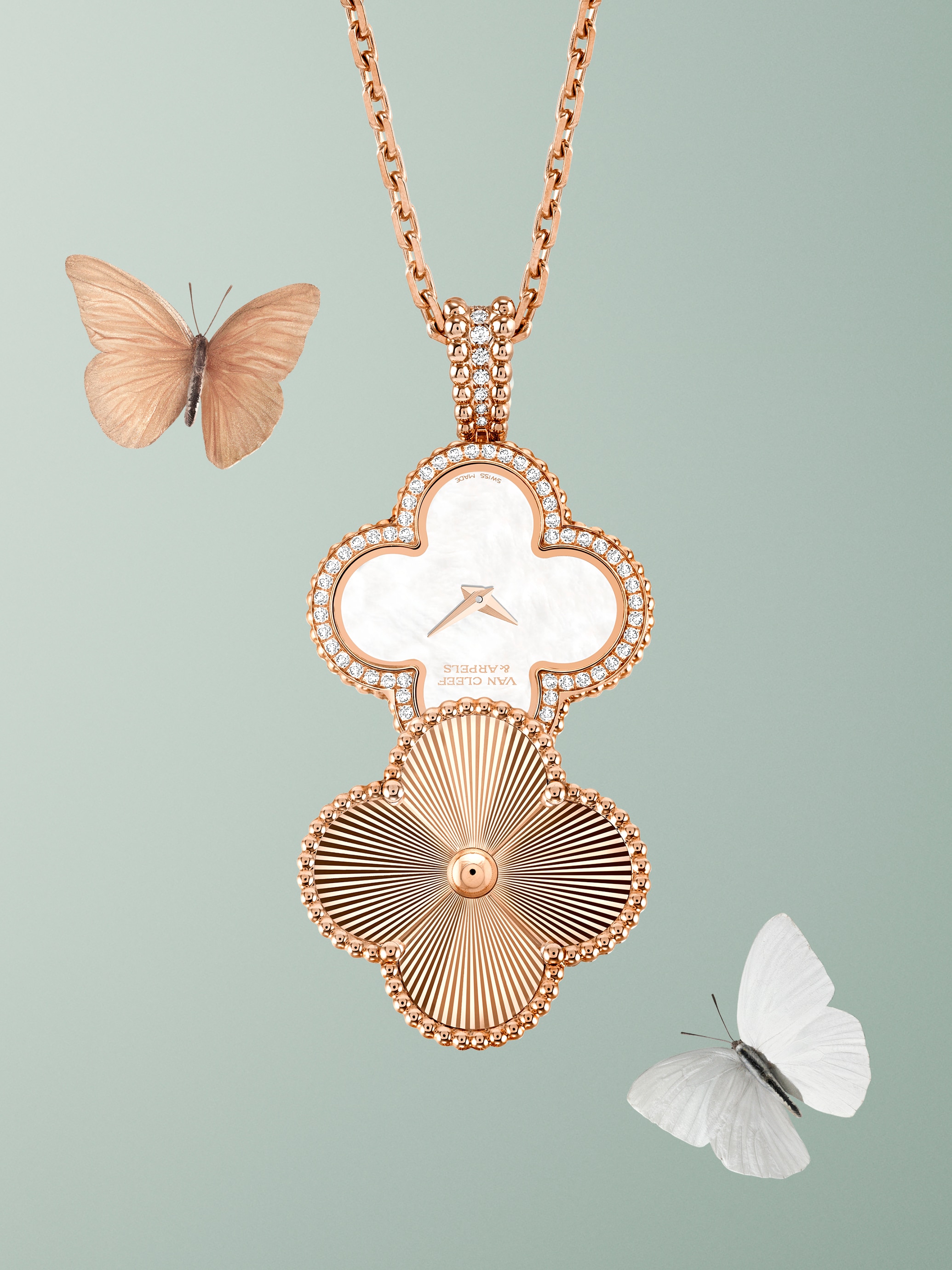 Alhambra secret pendant watch, 18K rose gold, mother-of-pearl, diamonds. Alhambra® collection, Van Cleef & Arpels.
