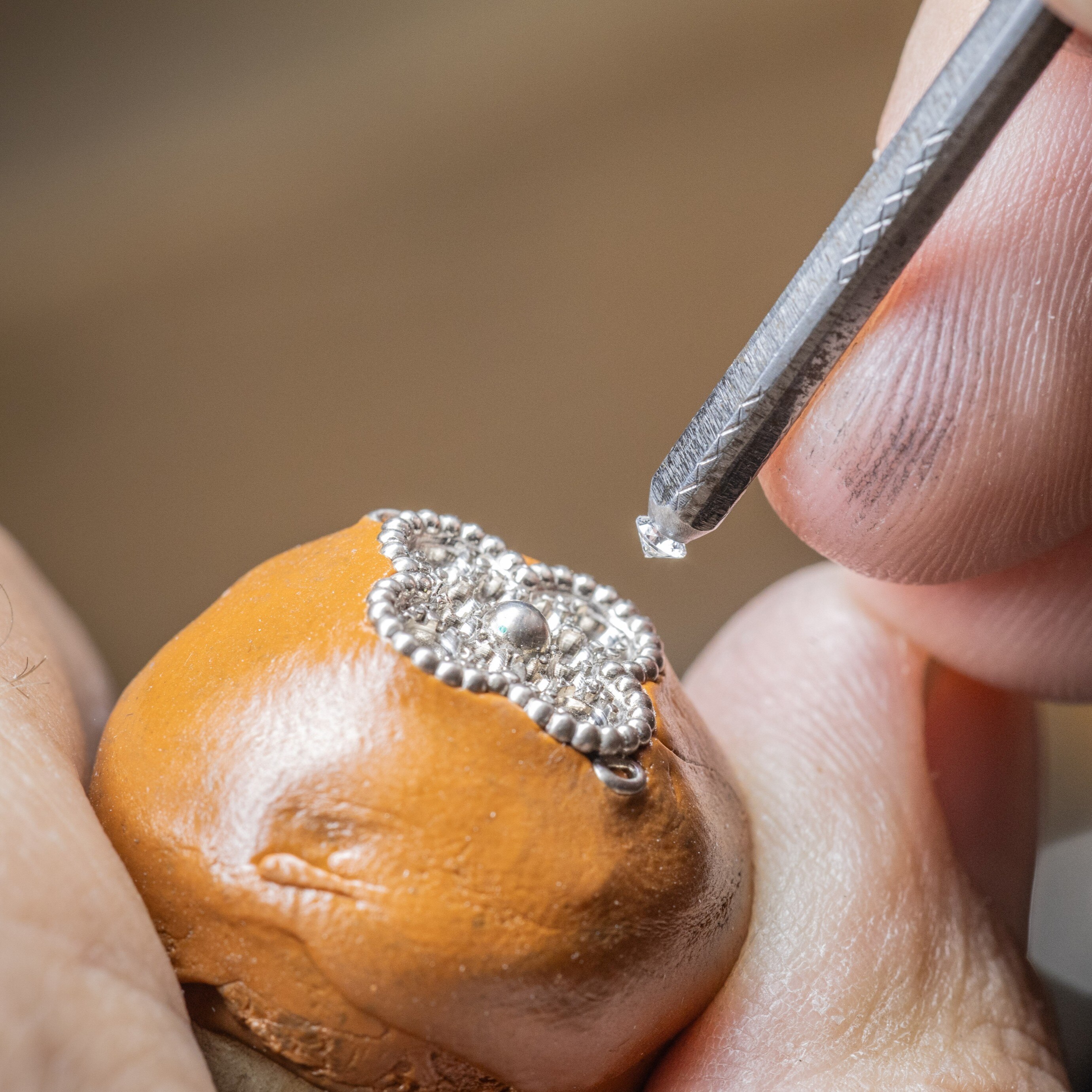 Setting of the gold motif of the Sweet Alhambra watch, Van Cleef & Arpels.