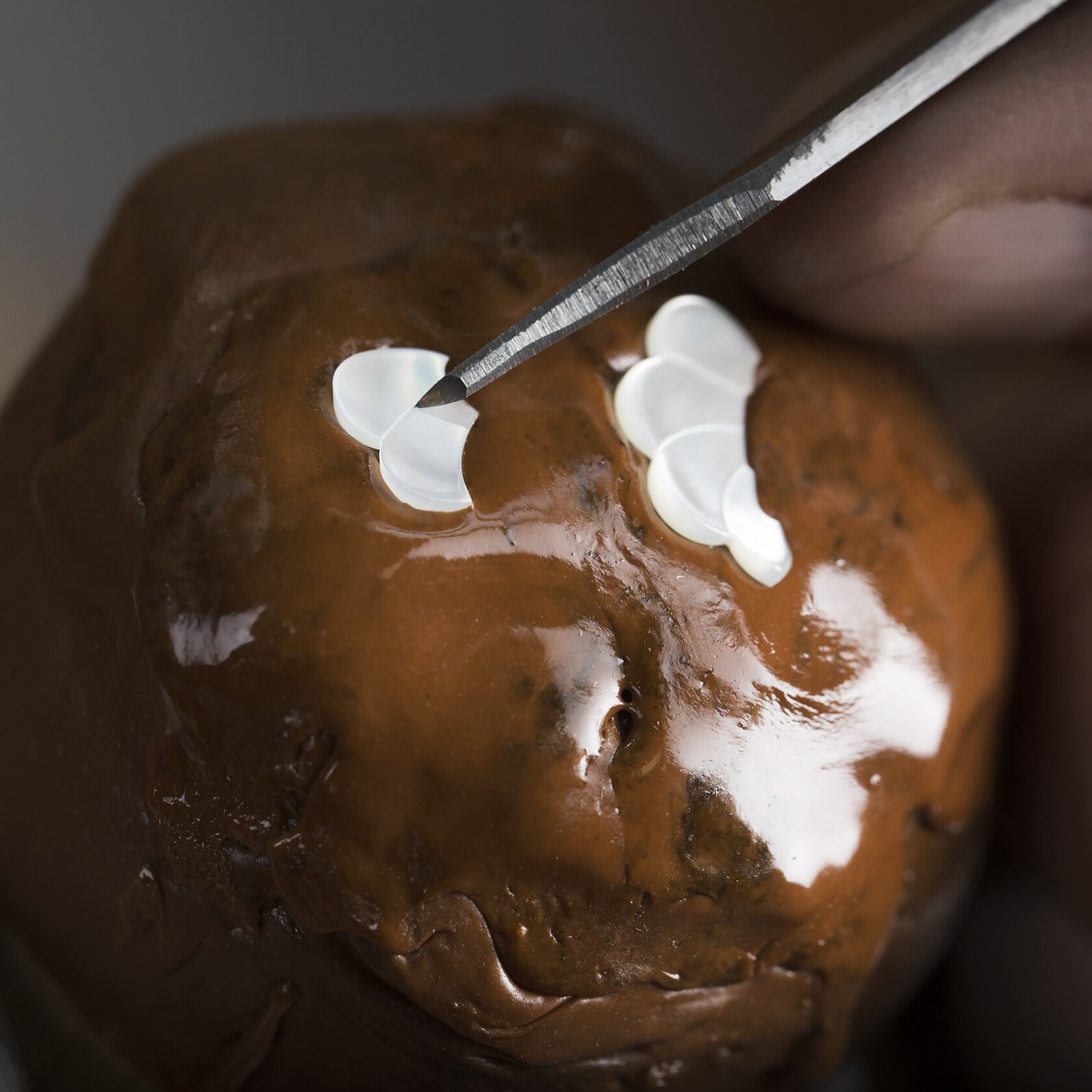 Sculpting the flower in white mother-of-pearl. Van Cleef & Arpels