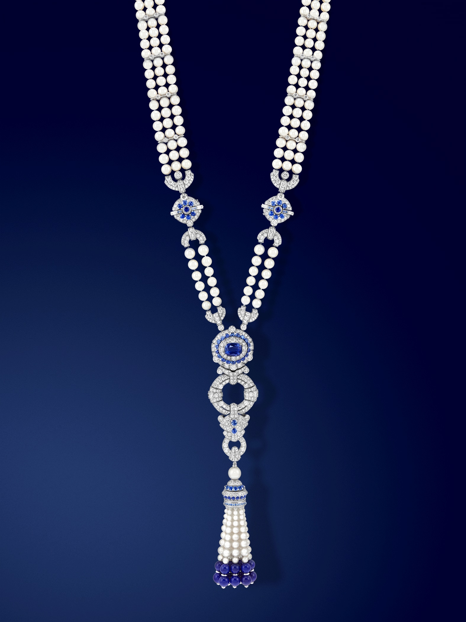 Pompon Margaret long necklace watch 18K white gold, one cushion-cut sapphire of 6,19 carats, sapphires, lapis lazuli, white cultured pearls, white mother-of-pearl, diamonds, Swiss quartz movement. Van Cleef & Arpels.
