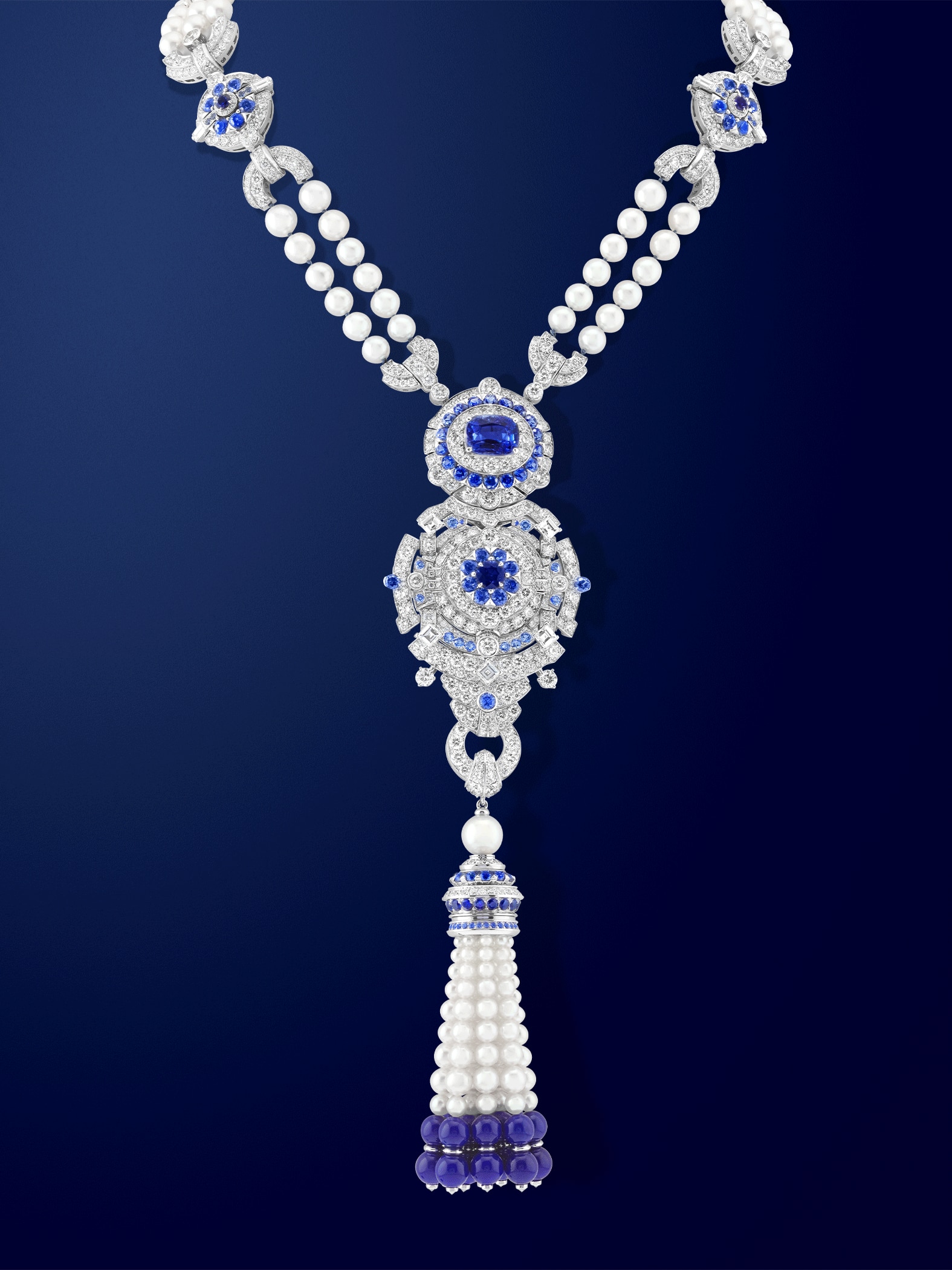 Pompon Margaret long necklace watch 18K white gold, one cushion-cut sapphire of 6,19 carats, sapphires, lapis lazuli, white cultured pearls, white mother-of-pearl, diamonds, Swiss quartz movement. Van Cleef & Arpels.