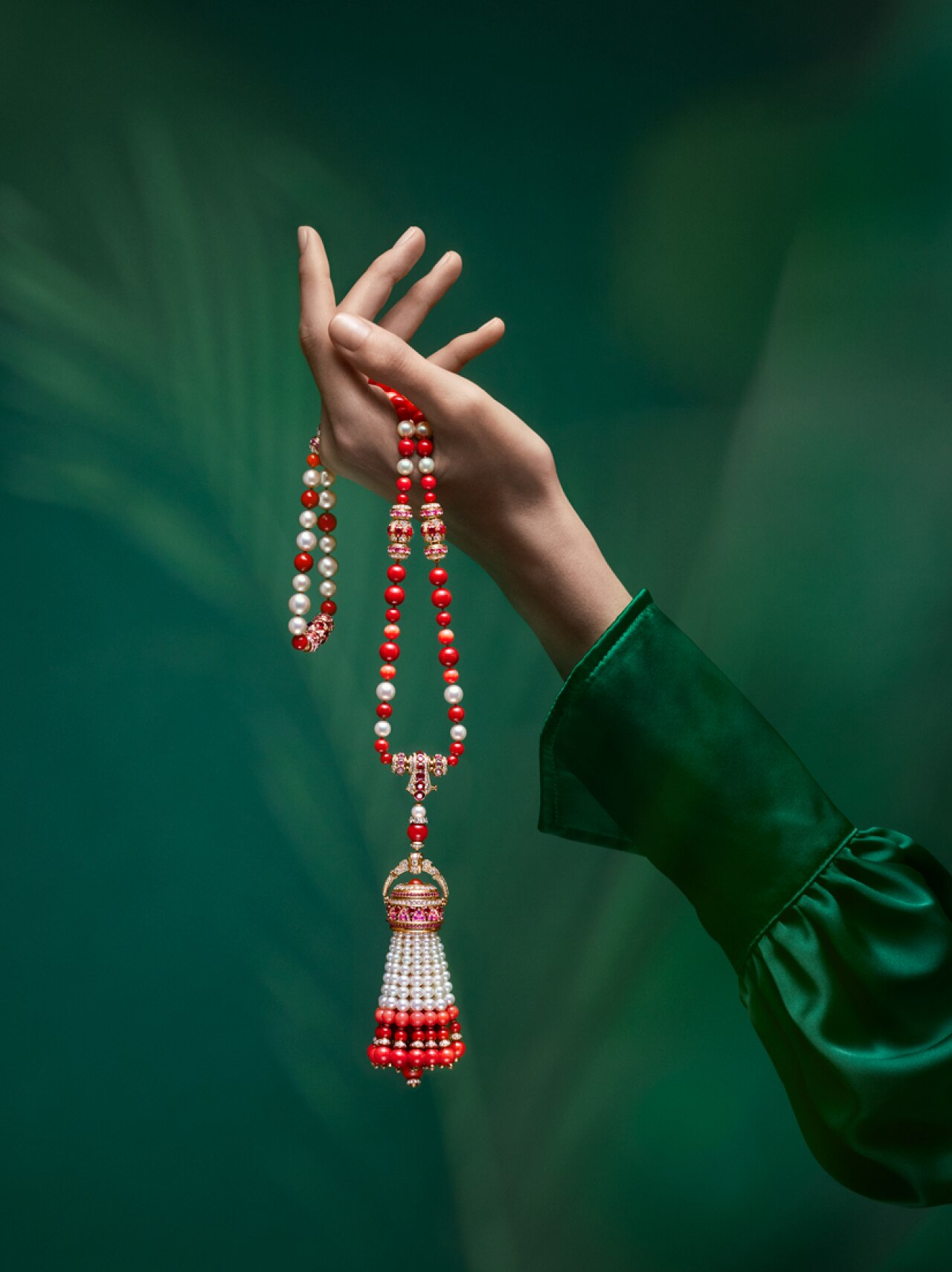 Pompon Gaia transformable long necklace watch 18K rose gold, pink sapphires, rubies, coral, white cultured pearls, white mother-of-pearl, diamonds, swiss quartz movement. Van Cleef & Arpels.