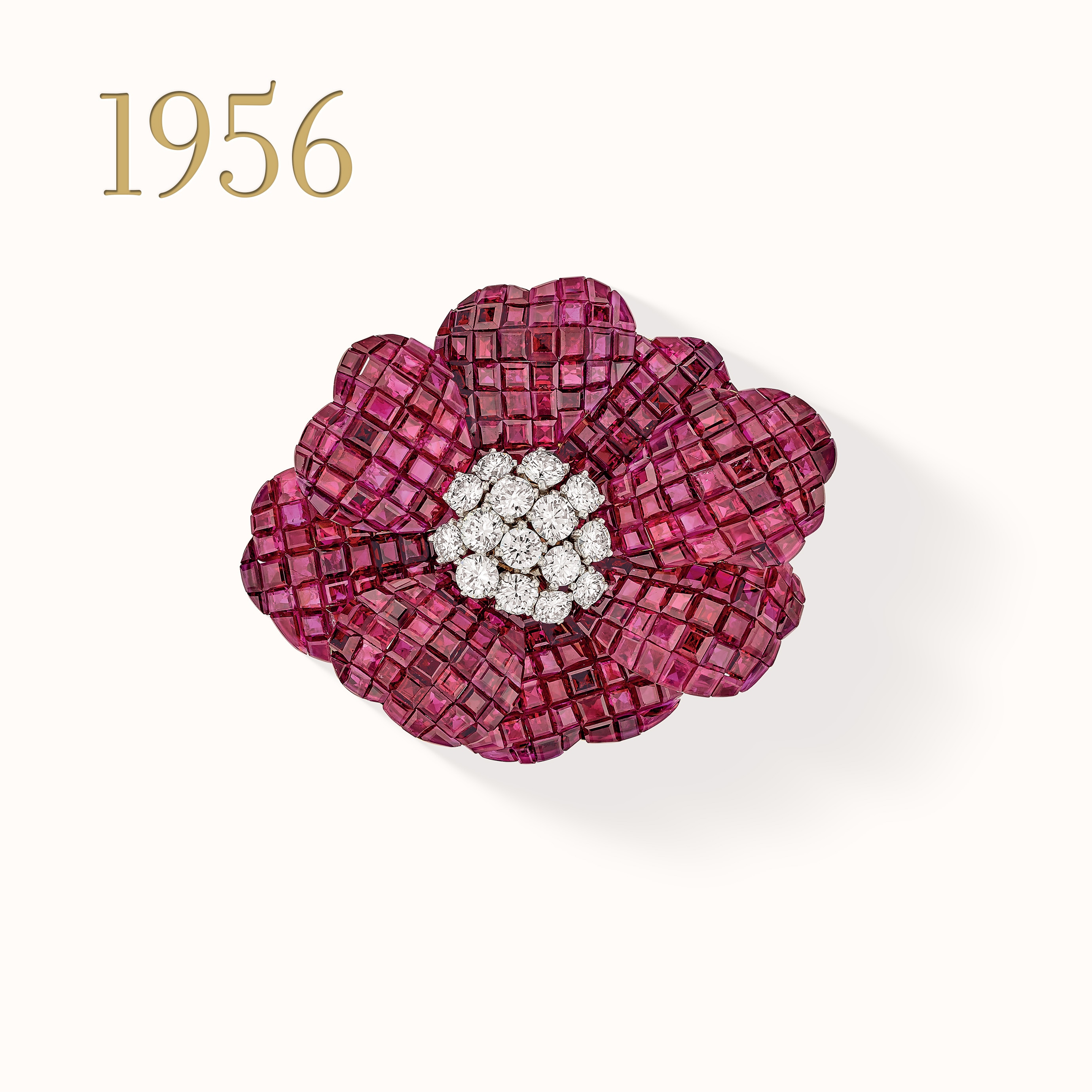 Poppy clip, platinum, yellow gold, Mystery Set rubies, diamonds. Van Cleef & Arpels collection.