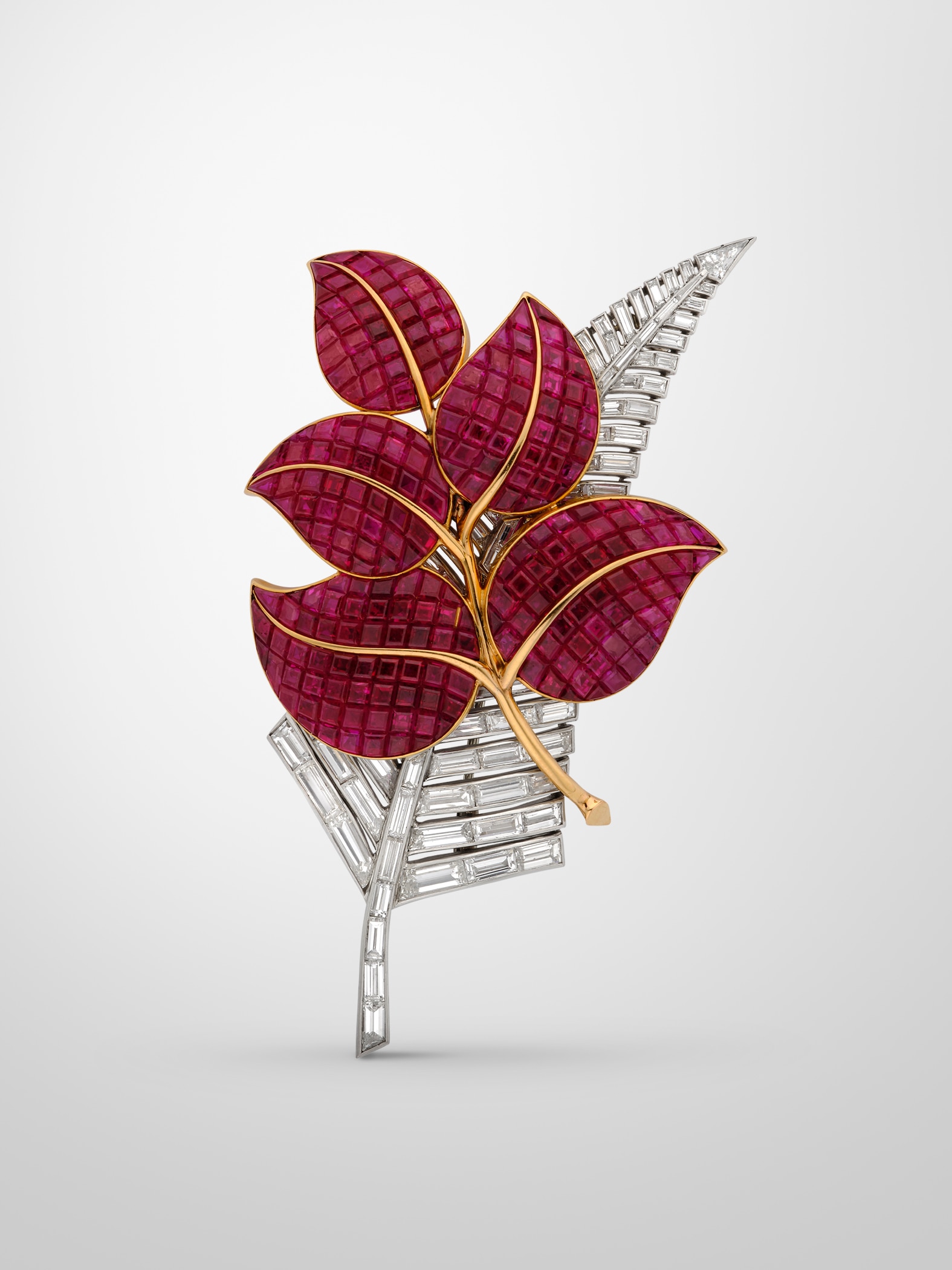 Leaf brooch, 1936, yellow gold, white gold, platinum, Mystery Set rubies, diamonds.  Van Cleef & Arpels.