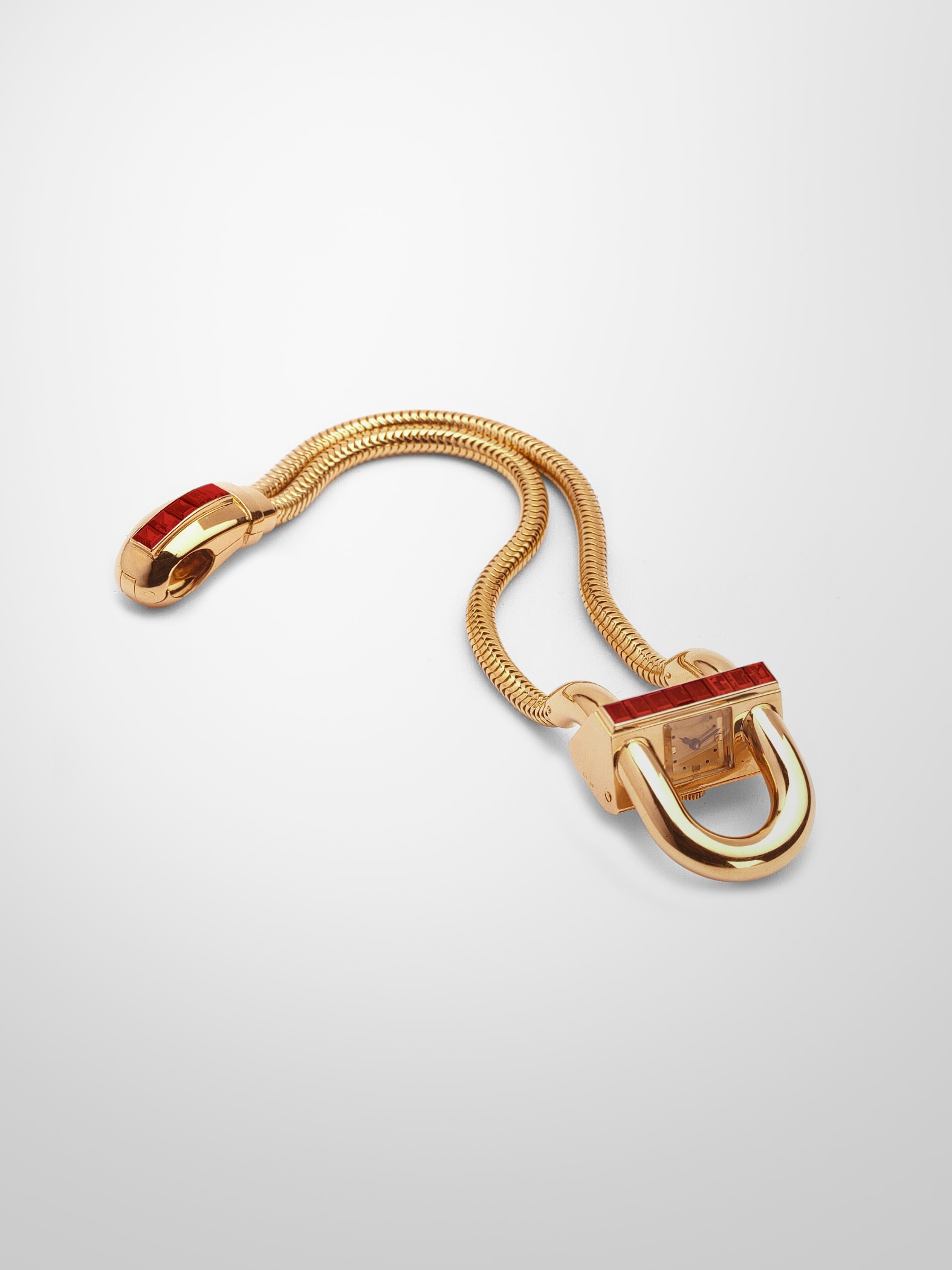 Cadenas wristwatch, 1939, yellow gold, rubies.  Van Cleef & Arpels collection