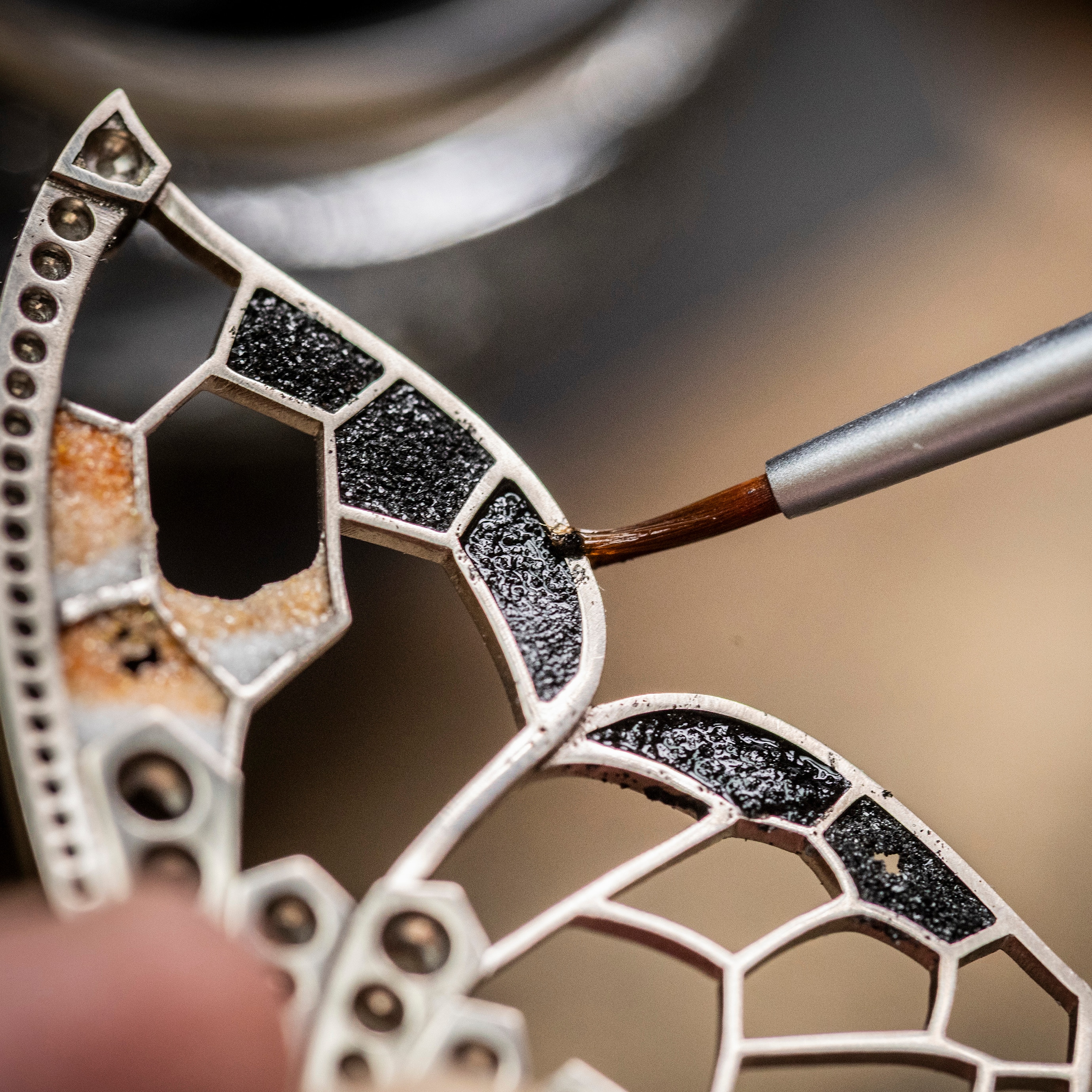 Applying enamel with the plique-à-jour technique on the butterfly’s wing, Van Cleef & Arpels.