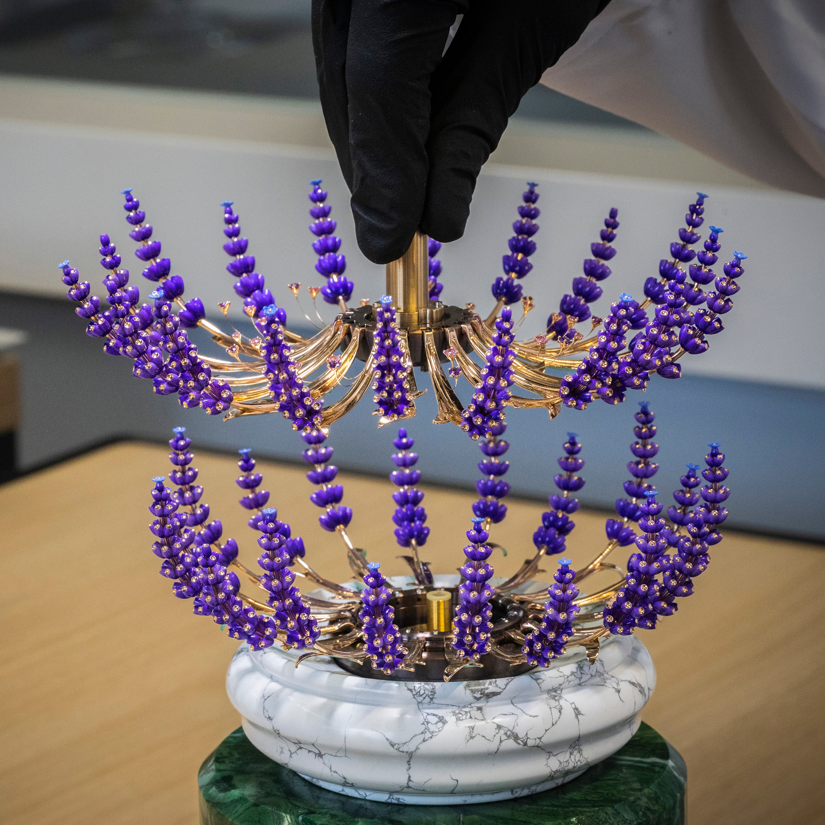 Positioning the inside row of the bouquet, Van Cleef & Arpels.