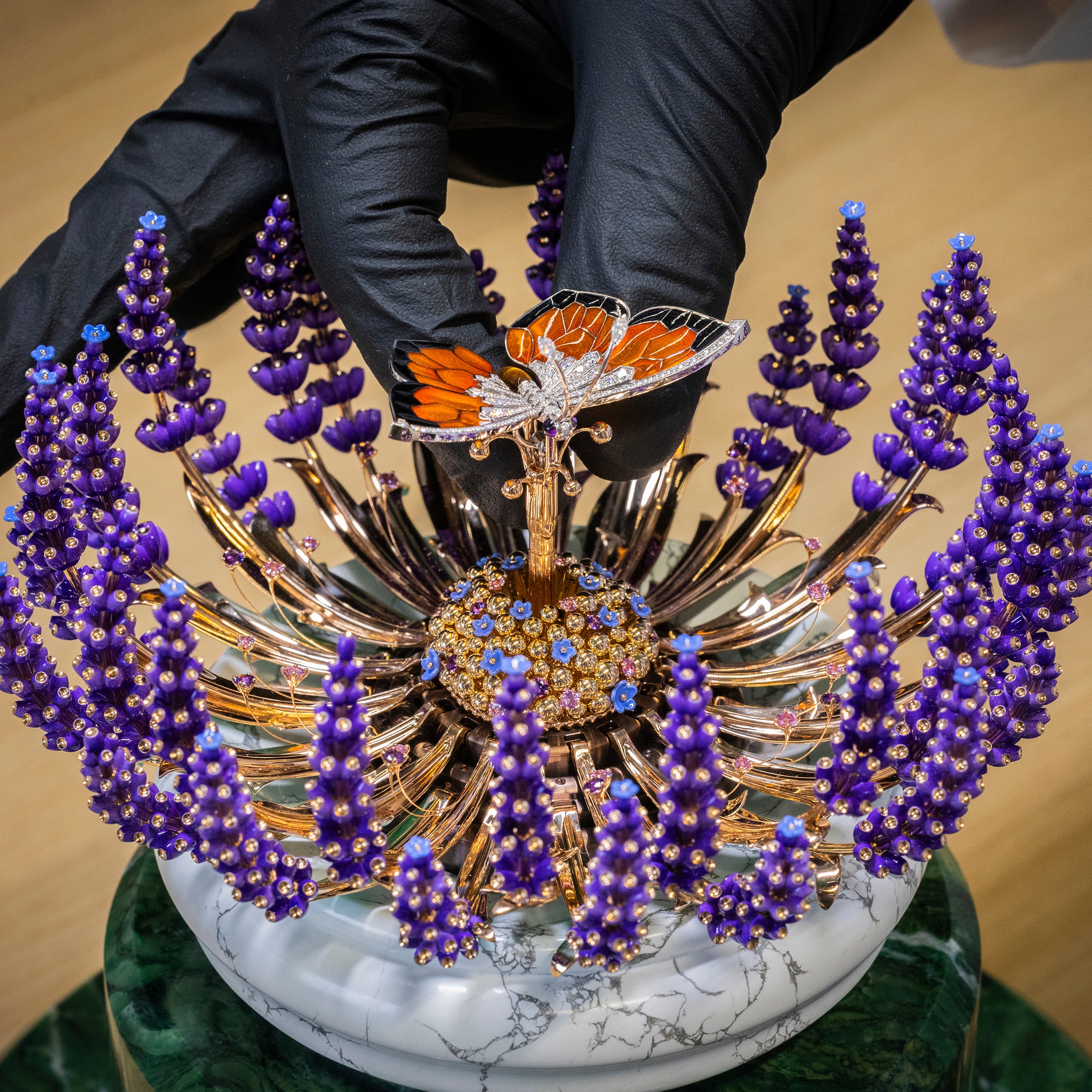 Positioning the butterfly in the center of the bouquet, Van Cleef & Arpels.