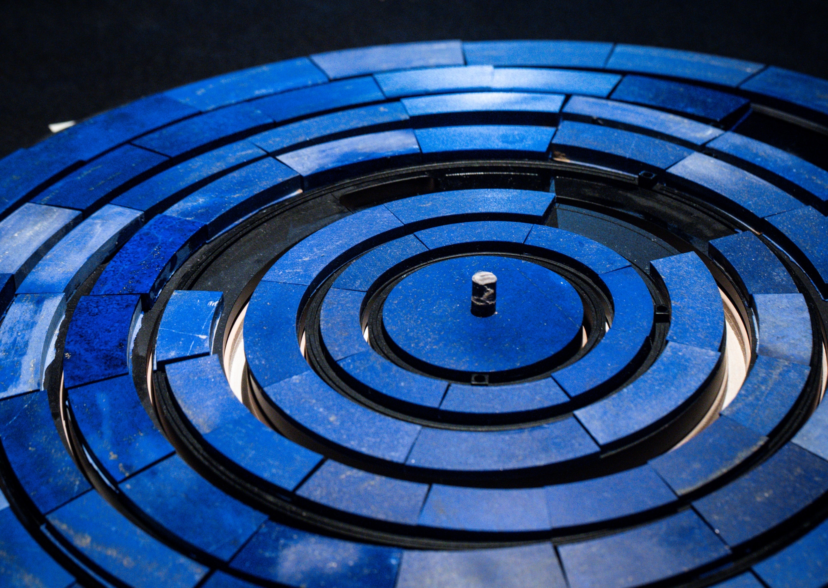 Assembling lapis lazuli patterns, Van Cleef & Arpels.