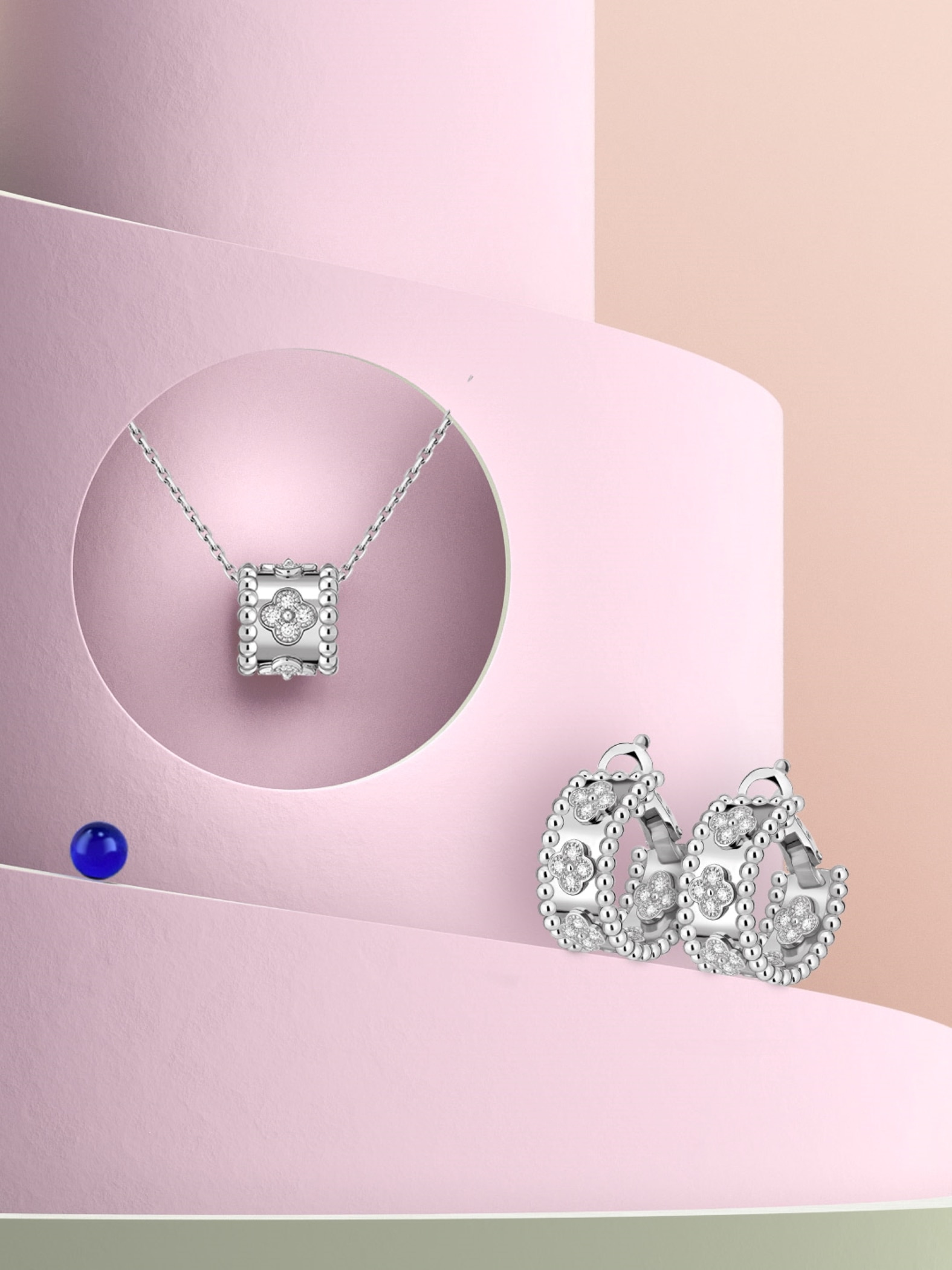 Perlée clovers pendant and hoop earrings, 18K white gold, diamonds. Perlée® collection, Van Cleef & Arpels.