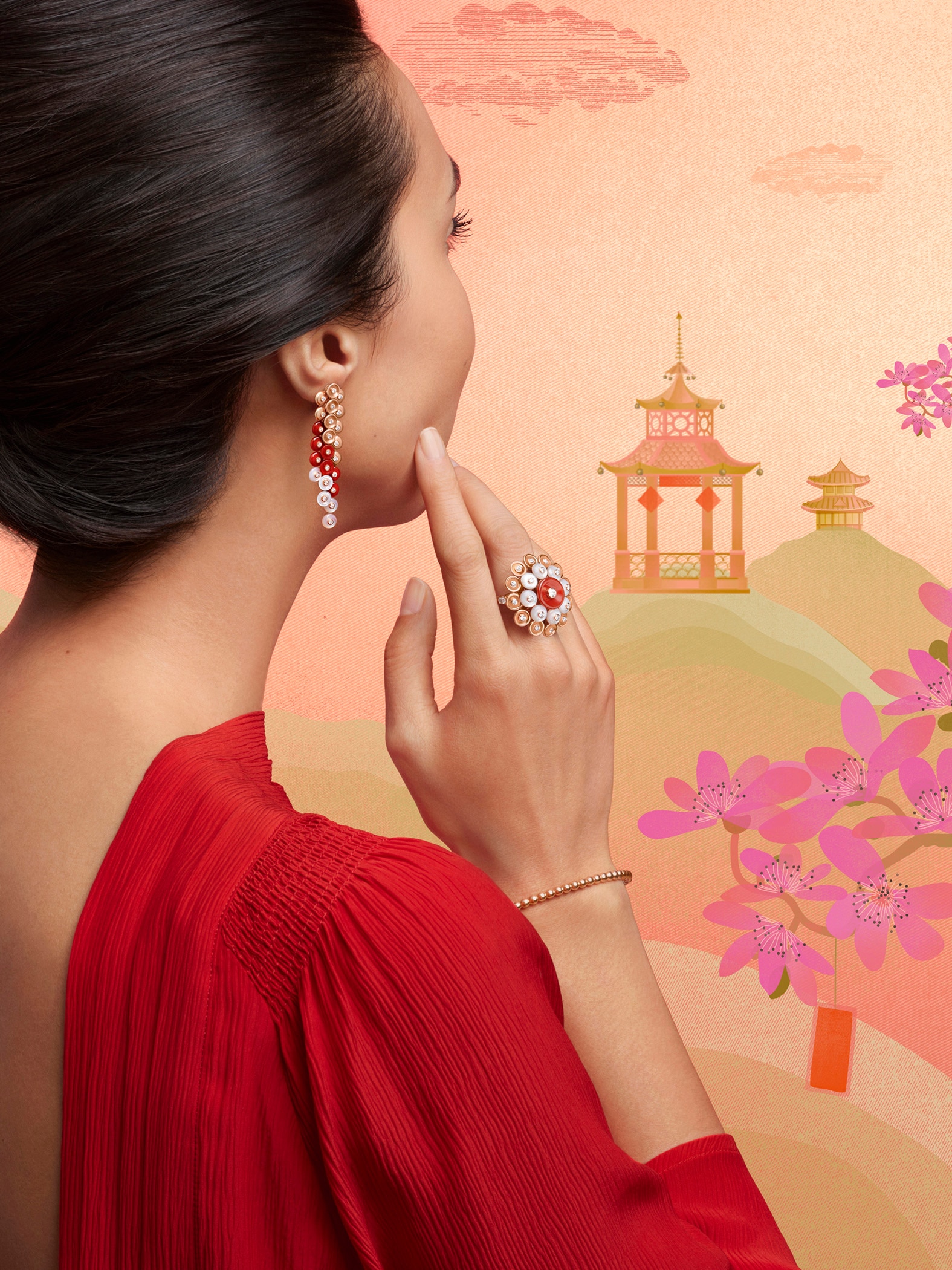 Bouton d’or® earrings and ring, 18K rose gold, white mother-of-pearl, carnelian, diamonds. Bouton d’or® collection.  Perlée® pearls of gold bracelet, 18K pink rose gold. Perlée® collection, Van Cleef & Arpels.