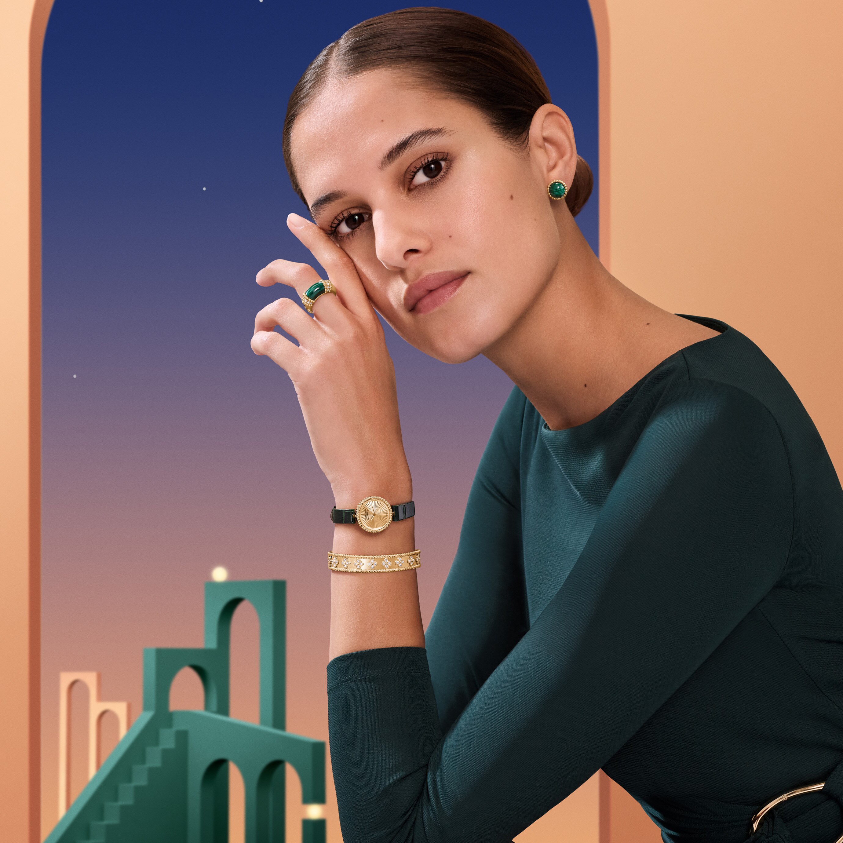 Perlée® couleurs earrings, 18K yellow gold, malachite. Perlée® couleurs ring, 18K yellow gold, malachite, diamonds. Perlée® watch, 23 mm, 18K yellow gold, guilloché 18K yellow gold, Swiss quartz movement. Perlée® clovers bracelet, 18K yellow gold, diamonds. Perlée® collection, Van Cleef & Arpels.