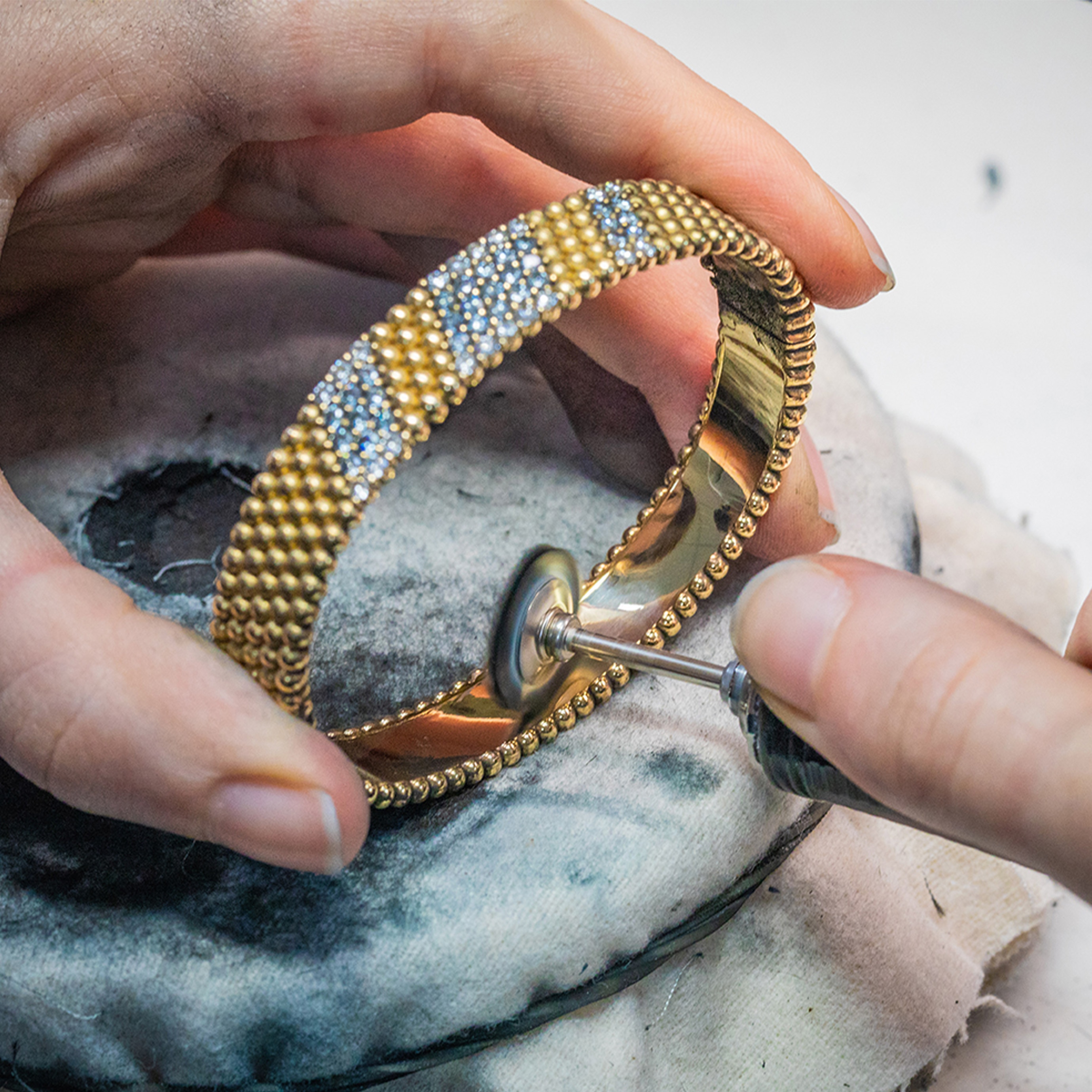 Brush polishing the inside of the bracelet, Van Cleef & Arpels.